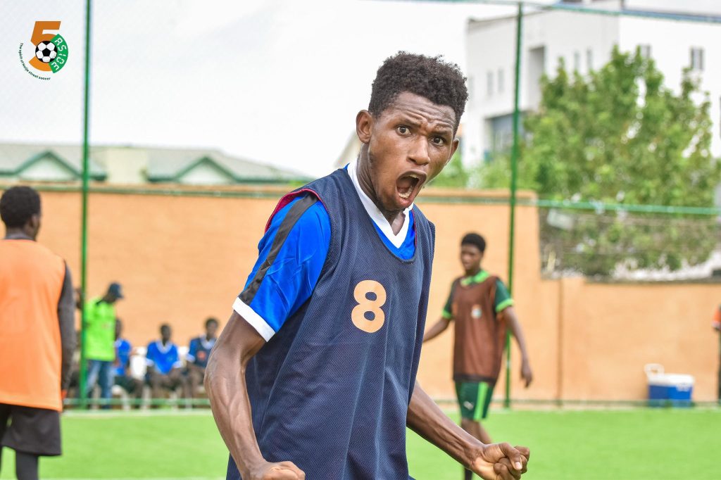 Milo of Soccer Gem FA celebrates passionately after scoring his third goal of the match against Useful Youth SA during the Spires 5-Aside Naija Street Football Tournament Season 2