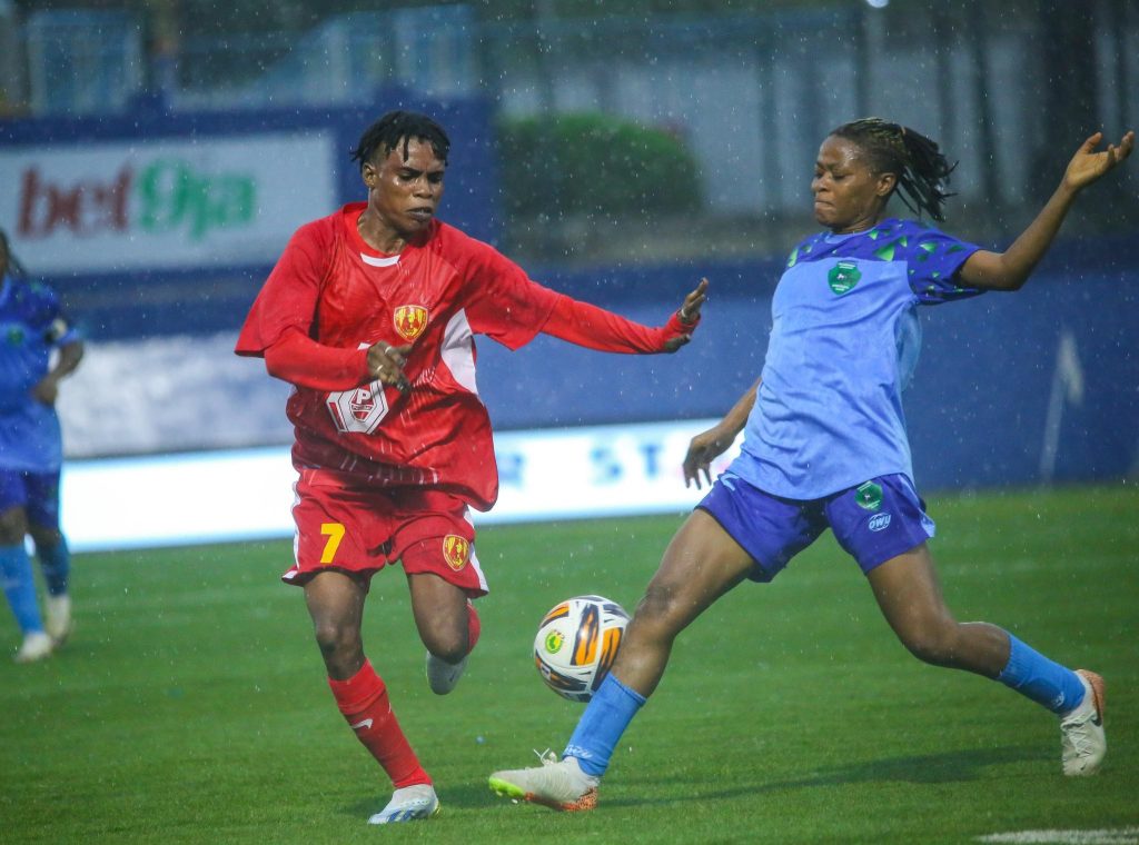 Two players from Nasarawa Amazons and Edo Queens fiercely battle for possession of the ball during their NWFL Super 6 fixture at Remo Stars Stadium in Ikenne.