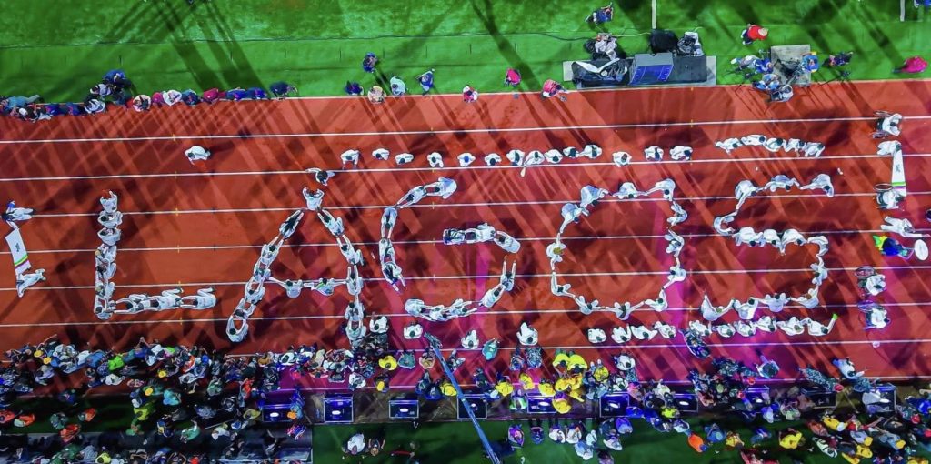 Lagos State athletes in vibrant uniforms performing a colorful display at the Gateway Games 2025 Opening Ceremony in Abeokuta